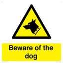 beware-of-the-dog-with-dog-warning-symbol~